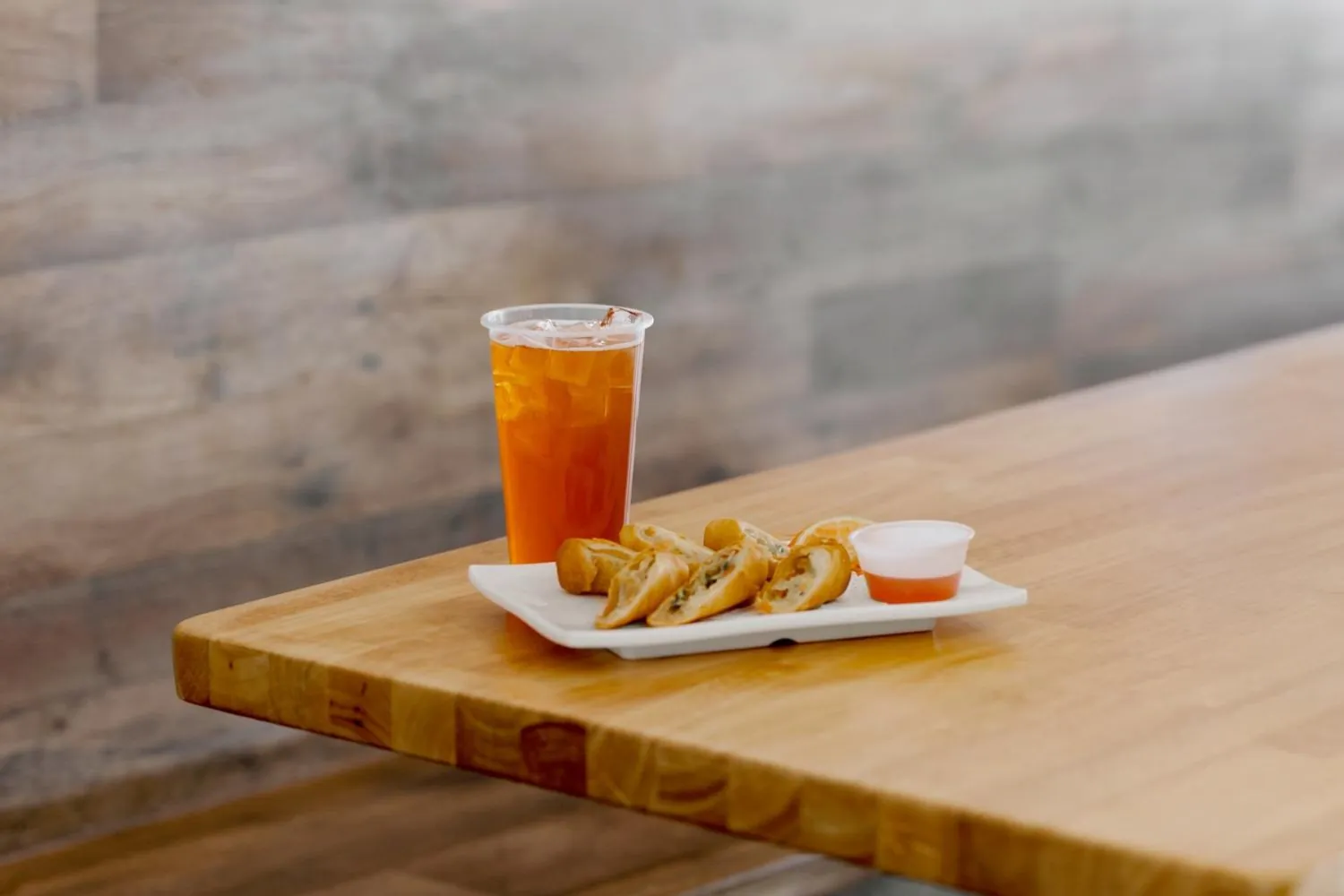 Iced Tea with Spring Rolls and Sweet Chili Sauce at Robins Poke & Ramen, Asian Restaurant in Warner Robins